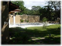 gated community, clubhouse, river, forest.